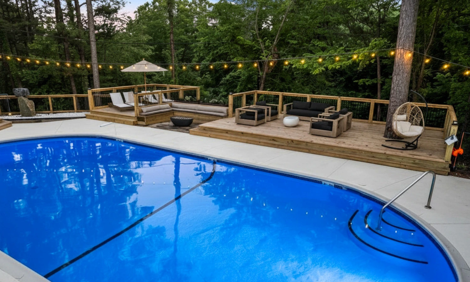 Pool deck at Forest Springs Resort surrounded by Ozark forest