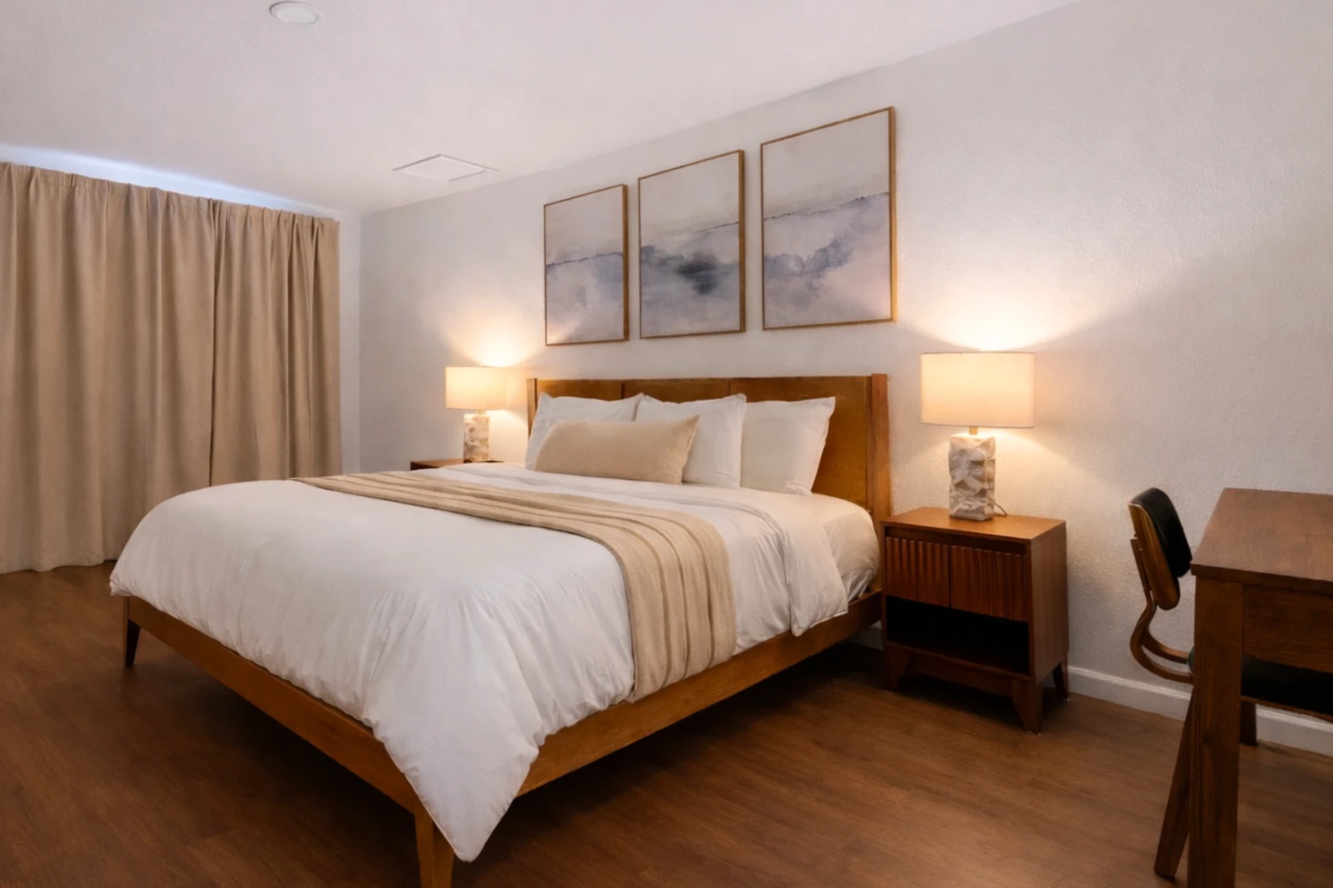 King room with curtained patio door and desk nook