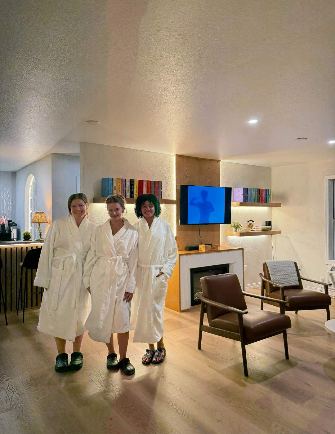 Guests in robes relaxing together in the lounge