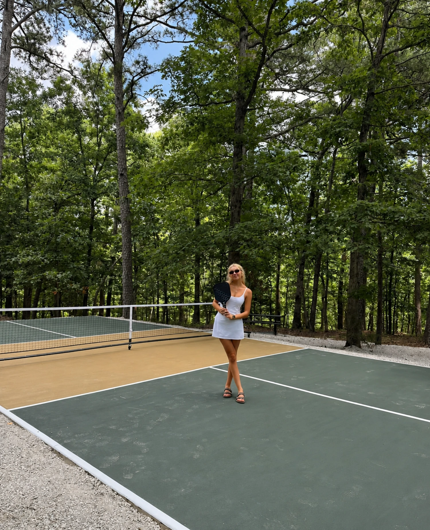 Pickleball court surrounded by Ozark pines at Forest Springs Resort