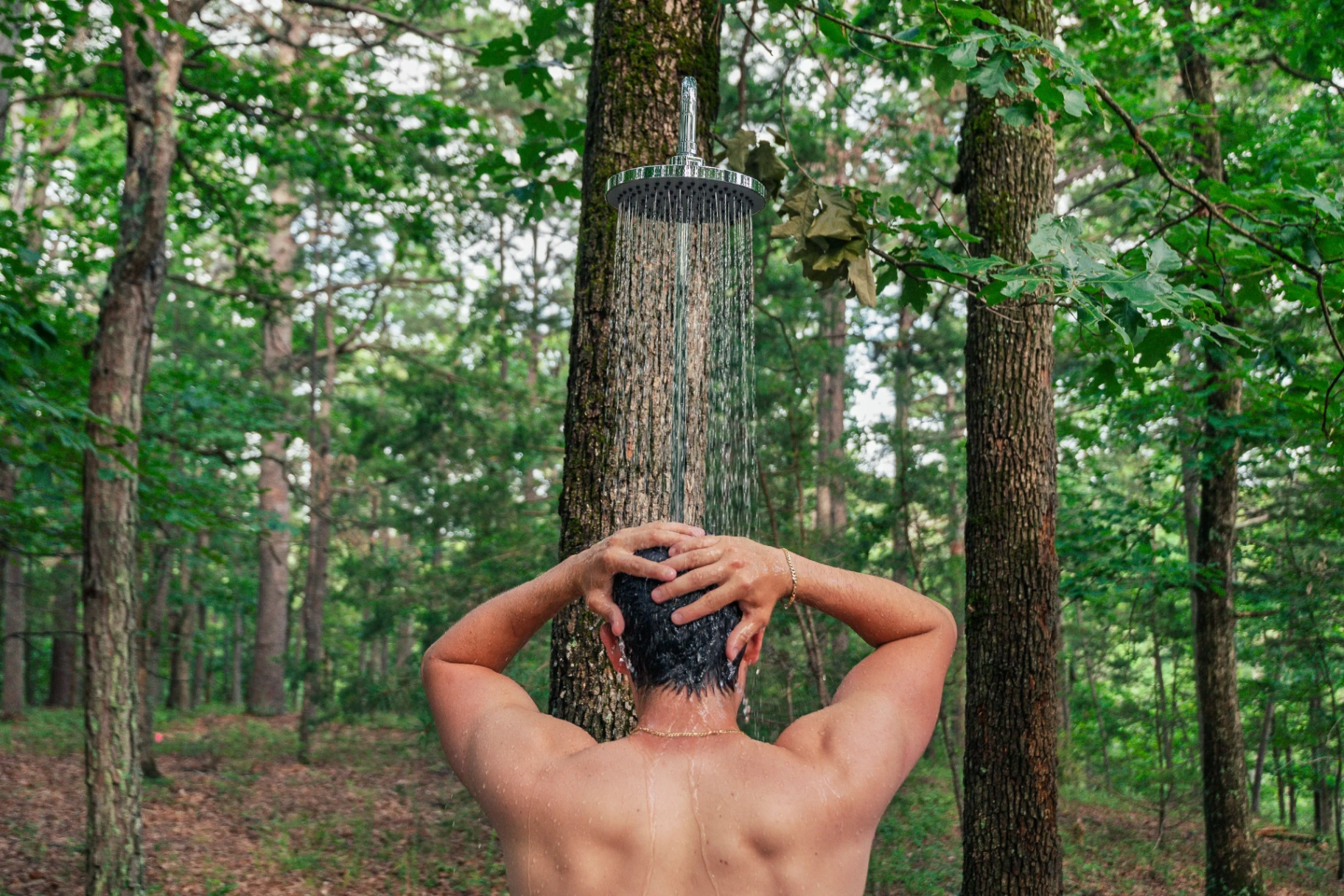 Outdoor forest shower amid Ozark trees