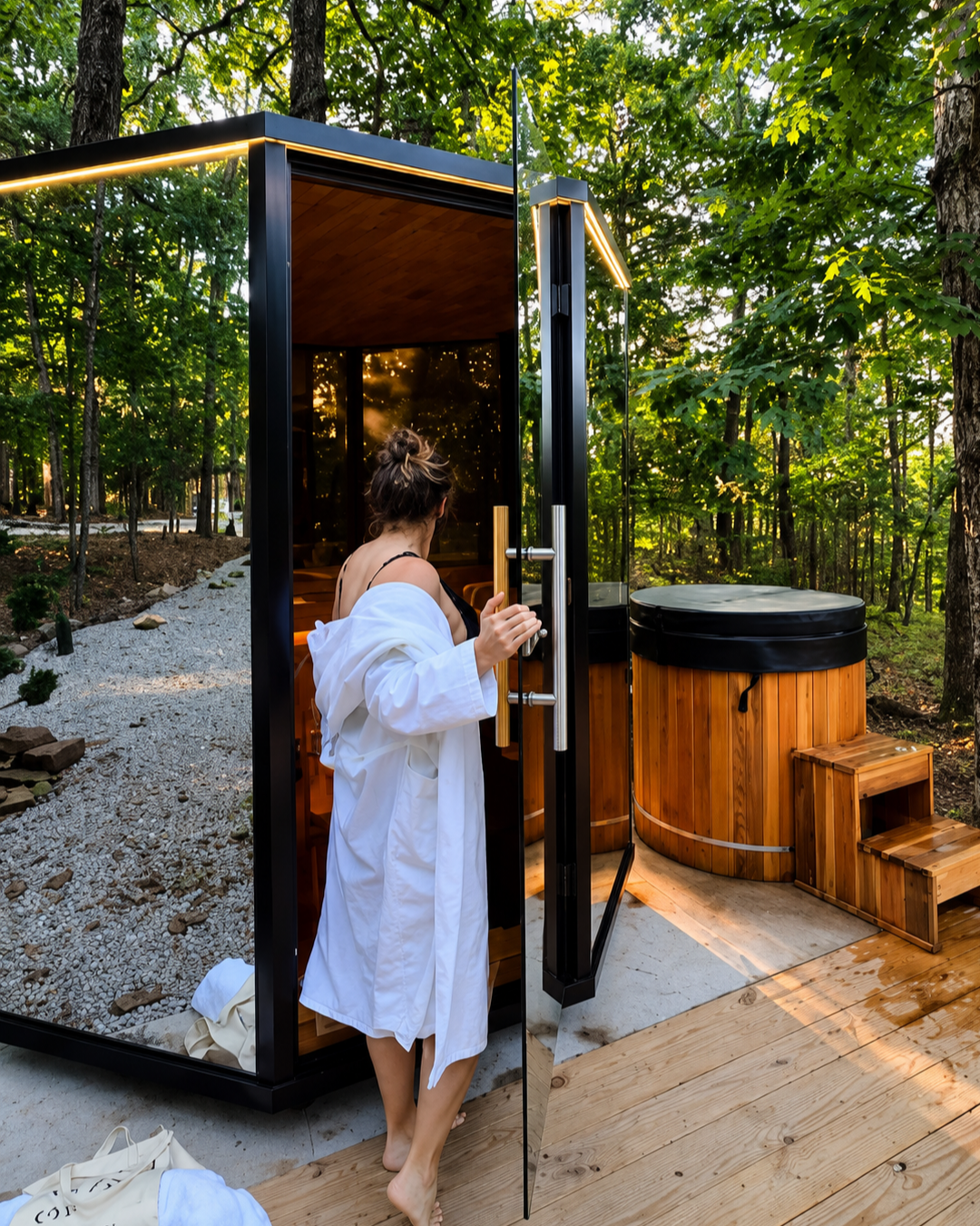 Guest in robe entering Nordic sauna at Forest Springs boutique hotel in Eureka Springs